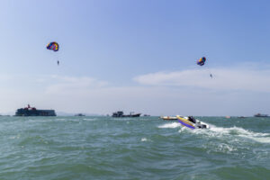 Outdoor sports parasailing in the sea with holiday activity summer travel plan