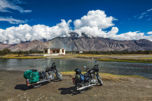 Moto tourism in India - two tourist bikes motorcycles in Nubra valley in Himalayas. Ladakh, India